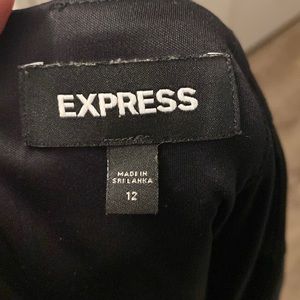 Black express suit skirt only worn 3 times. I lost Weight so it is too big